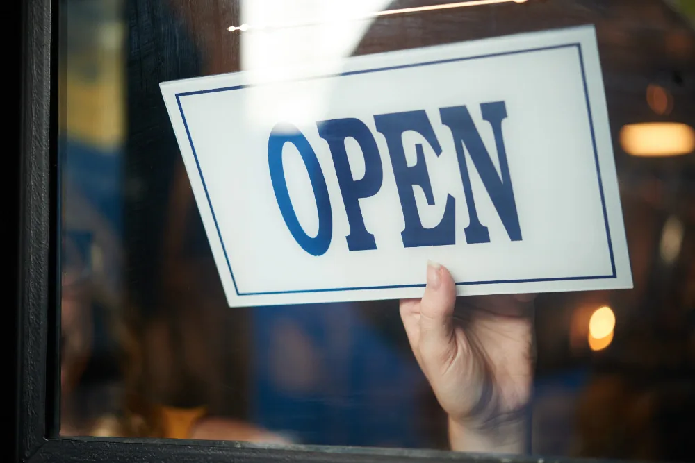 Now Open window clings and banners designed by MSE Printing