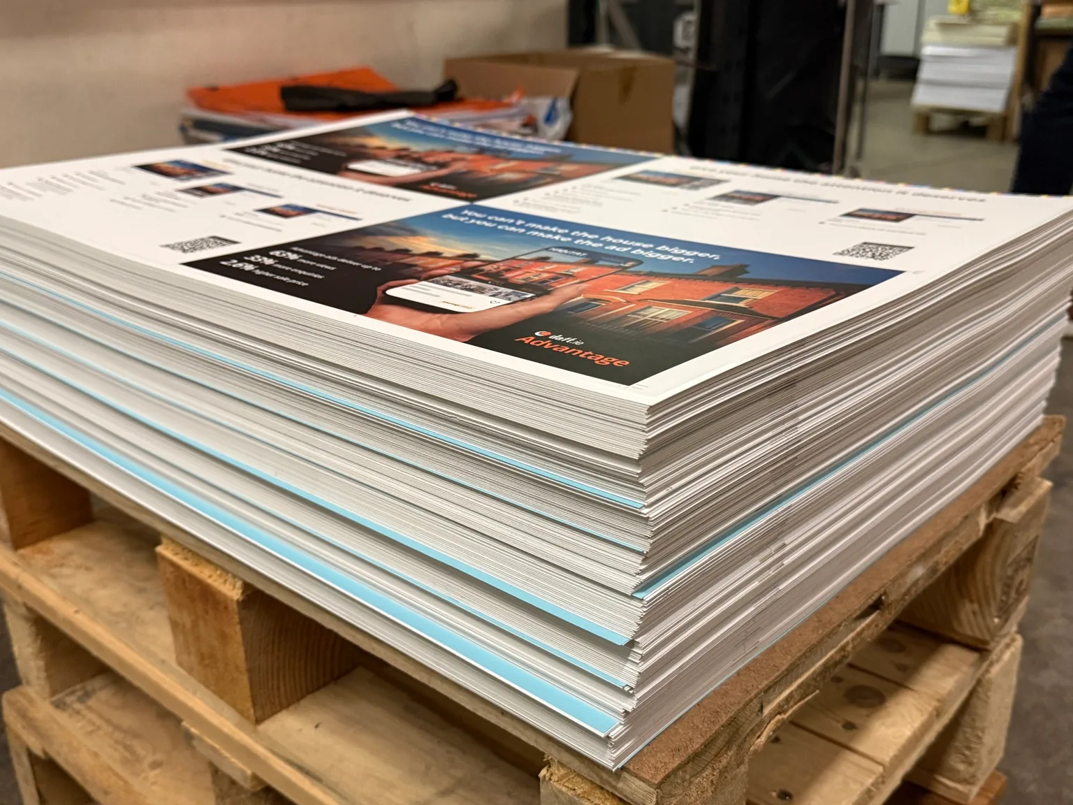 Stacks of full-color printed sheets on a pallet at Park Print’s Dublin facility